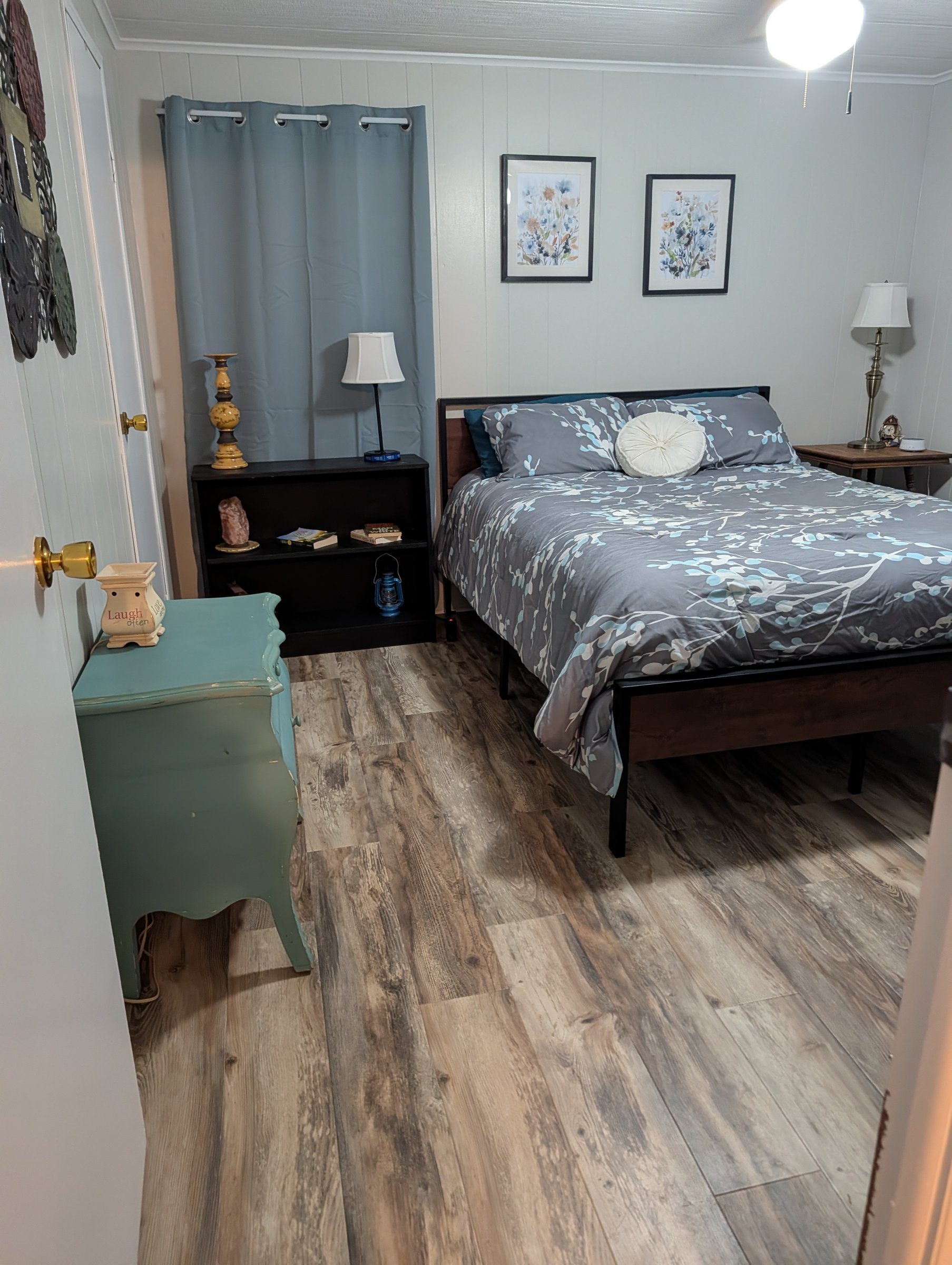Master bedroom has a queen size bed, ceiling fan, smart tv, privacy blinds and curtains, a walk-in closet, and direct access to the master bathroom.